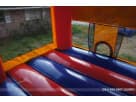 13x13 Minecraft bounce house rental in Houston with red, blue, and orange panels—perfect for Kingwood birthday parties.