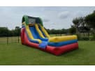 Colorful 15ft water slide rental in Austin with attached pool, ideal for Cedar Park backyard parties.