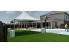 15ft x 15ft high peak tent rental in Houston backyard with green frame, seating up to 37 guests for weather-protected outdoor