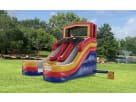Colorful dual-lane water slide rental in Austin with red, yellow, and blue panels—ideal for two kids racing down simultaneously