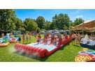 Perfect for Austin summer parties, this 3-lane slip n slide water rental features triple racing lanes ideal for kids' competitive