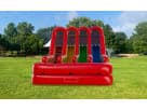 3 Lane Rainbow Wet/Dry Slide rental in Houston with vibrant multi-colored lanes, ideal for Spring birthday parties