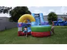 Perfect for Houston summer parties, this 34ft retro water slide rental features a slip-n-slide combo with tunnel and vibrant