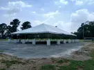 Perfect for Houston events, this 40ft x 60ft frame tent rental features gray peaked roof design ideal for League City outdoor