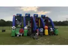 Perfect for Buda birthday parties, this sports-themed interactive bounce house rental in Austin features multiple slides
