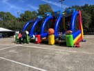 4in1 Sports Challenge interactive bounce house rental in Austin with basketball hoop and slides, ideal for Leander parties.