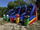 4in1 Sports Challenge interactive bounce house rental in Austin with dual slides and basketball hoop, ideal for Buda birthday