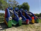 Sports-themed interactive bounce house rental in Austin with dual slides, ideal for Round Rock birthday parties and family events.