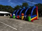 Blue and red 4in1 Sports Challenge obstacle course rental in Dallas with multiple tunnels and climbing sections, ideal for Plano