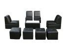 Black 8-person lounge furniture set with armless chairs, high-backed seating, and cubic ottomans available for Houston party