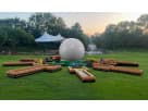 9 Hole Putt-Putt Golf Challenge rental setup in Dallas with inflatable ball and wooden obstacles on grass, ideal for Mesquite