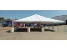 White peaked-roof tent rental in Houston with beige pillars, ideal for Pearland parties and community events.