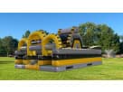 Construction-themed obstacle course rental in Dallas with rock climb and dual slides, ideal for Arlington birthday parties.