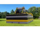 Yellow and black obstacle course bounce house rental in Austin with rock climb and dual slides, ideal for Kyle birthday parties