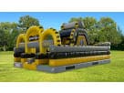 Yellow and black obstacle course rental in Austin with rock climb and slide, ideal for junior adventurers in Pflugerville.