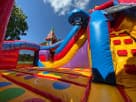 Colorful toddler bounce house rental in Austin with slides and climbing features, ideal for Cedar Park birthday parties