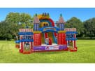Colorful amusement park obstacle course rental in Austin with rock wall and dual slides, ideal for carnival-themed parties