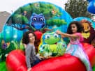 Animal Kingdom toddler bounce house rental in Dallas with owl and frog characters, ideal for Lewisville backyard parties.