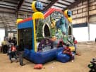 13x13 Monsters University bounce house rental in Dallas with blue and yellow graphics, perfect for Irving birthday parties