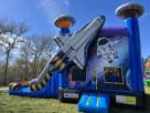 Perfect for Houston birthday parties, this space shuttle bounce house rental features a wet or dry slide and basketball hoop