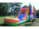 Colorful 3-in-1 bounce house with orange slide rental in Houston, ideal for Kingwood backyard parties with wet or dry play