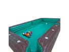 Giant billiards pool table soccer inflatable rental in Austin with turquoise playing surface, ideal for interactive party games