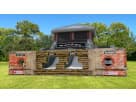 Black Ops obstacle course rental in Dallas with dual slides, rock wall, and rocking bridge challenge—ideal for active kids'