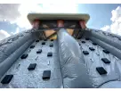 Curso de obstáculos Black Ops con muro de escalada y toboganes duales disponible para renta en Austin — ideal para eventos
