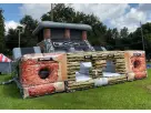 Black Ops obstacle course rental with dual slides and rock wall at a Dallas park, ideal for Plano birthday parties.