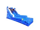 Dual-lane blue water slide rental in Austin with curved climbing wall and splash basin, perfect for Round Rock summer parties.