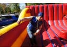 Red and yellow interactive bounce house rental for Austin kids ages 5 and up, perfect for indoor events and large parties