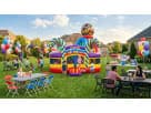 Candy theme bounce house rental in Dallas with bright yellow, blue and red sections—ideal for Garland birthday parties.