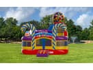 Candy-themed bounce house rental in Dallas with dual swirl towers and ball pit, ideal for Mesquite kids' parties.