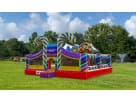 Colorful candy-themed toddler bounce house rental in Dallas with dual towers and slide, ideal for small children's parties