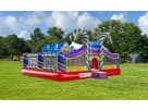 Perfect for toddler parties in Austin, this colorful Candy Playland obstacle course rental features dual slides and towers