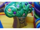 Colorful candy-themed toddler bounce house rental in Austin with swirled lollipop design, ideal for young children's parties