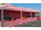 Perfect for Cedar Park events, this red and white striped 8'x8' carnival tent rental in Austin features protective sidewalls
