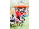 Carnival-themed carousel bounce house rental in Houston with colorful horse graphics, ideal for Spring birthday parties