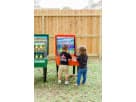 Children playing interactive ring toss carnival game rental in Houston backyard with arcade games, ideal for Pasadena parties.