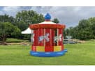 Carousel bounce house rental in Houston with colorful horse decorations, ideal for Kingwood carnival-themed parties.