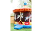 Carousel bounce house rental in Houston with hand-painted horses, ideal for carnival-themed parties in Cypress.