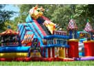 Colorful wild animal obstacle course rental in Austin with dual slides and rock wall, ideal for Round Rock birthday parties