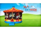 Colorful carousel bounce house rental in Houston with decorative horses, ideal for Pearland carnival-themed parties and events.