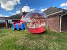 Inflatable snow globe rental with Christmas lights in Dallas, perfect for Grand Prairie holiday parties and events.