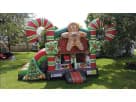 Perfect for Leander holiday parties, this gingerbread bounce house rental in Austin features a Christmas tree slide and candy