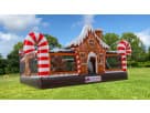 Gingerbread Wonder Playland bounce house rental in Dallas with candy cane decorations and slide, ideal for Frisco holiday parties.