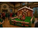 Gingerbread house bounce castle rental in Houston perfect for Christmas parties, featuring red and white candy cane details