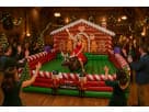 Perfect for Houston holiday parties, this gingerbread house rental features a festive candy cane design ideal for all ages.