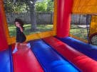 13x13 Christmas bounce house rental in Dallas with red and blue design, perfect for Garland holiday parties and festive backyard