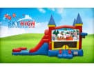 Christmas bounce house rental with slide in Houston—red, blue, and yellow 3in1 moonwalk perfect for holiday parties